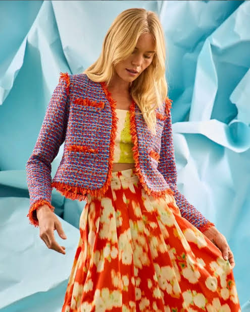 Tweed jacket paired with floral skirt